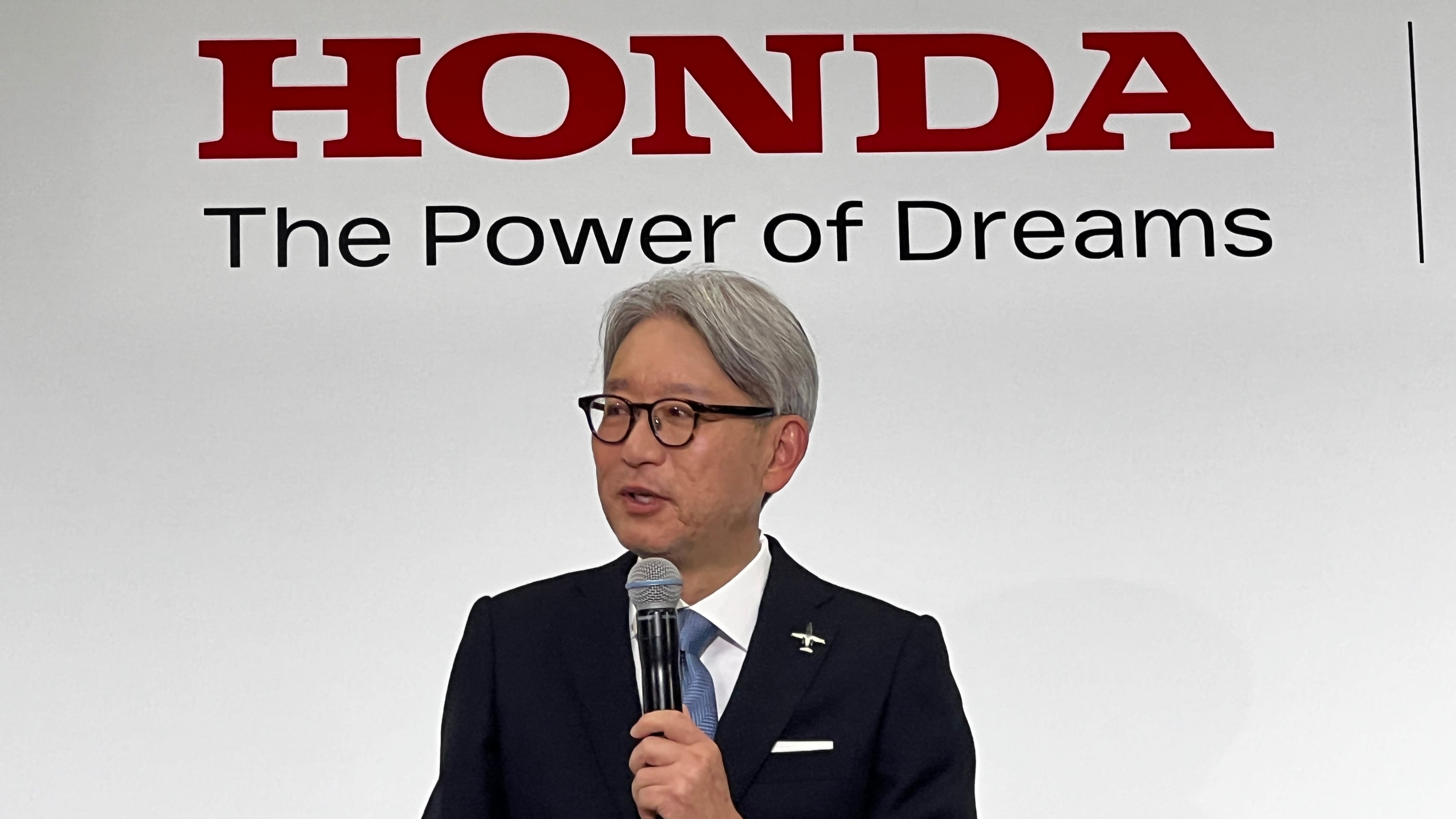 Honda CEO Toshihiro Mibe, seen here giving a business plan update May 20 in Tokyo, says the company will scale back investment in EVs and focus on hybrids instead.